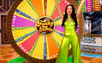 Live game show host presenting at colorful Funky Time wheel